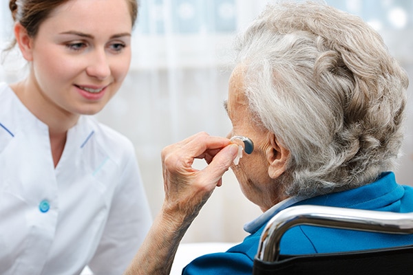 an older woman wearing hearing aids