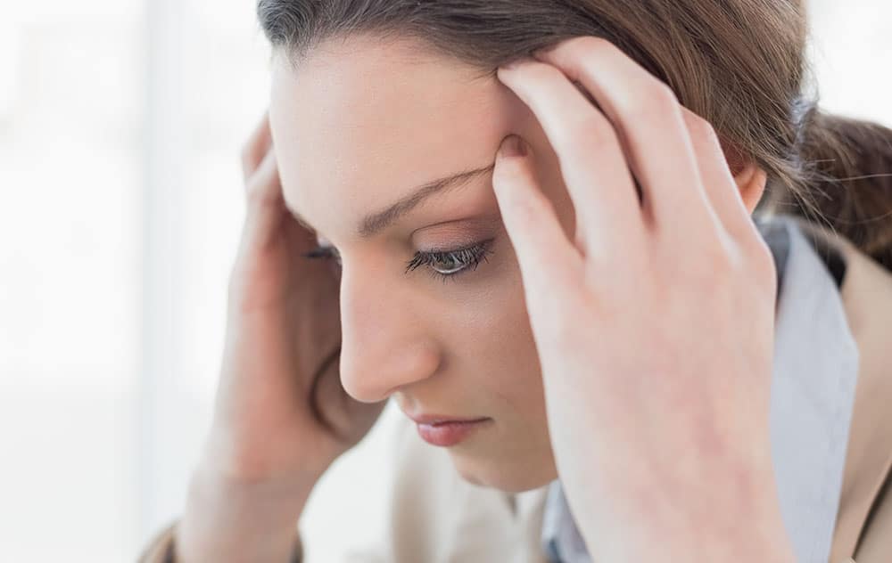 a woman experiencing ringing in her ears