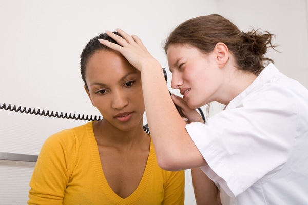 hearing specialist examining patient's inner ear