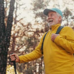 Happy senior man on a hike