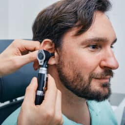 Man getting an ear exam.