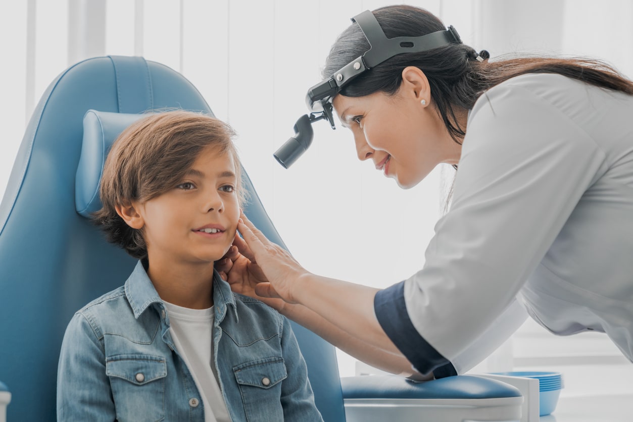 Young boy in an ear exam.