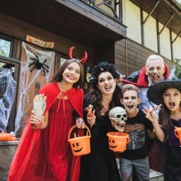 Family taking a picture in their halloween costumes