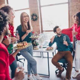 Coworkers enjoying their holiday party at the office