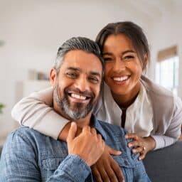 Happy father and daughter smiling together.